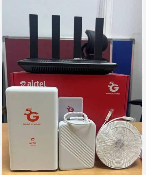 Airtel Uganda 5G Smart Connect CPE kit — outdoor 5G CPE panel, indoor CPE unit, Cat6 Ethernet cable coil, and TP-Link WiFi router, all components for Airtel 5G fixed wireless home internet connection in Uganda